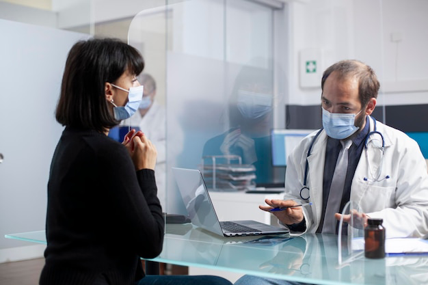 doctor-consults-with-sick-lady-clinic_482257-11914