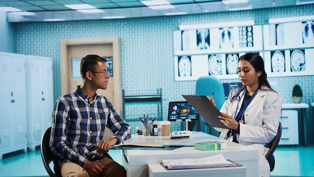 healthcare-provider-consulting-male-patient-review